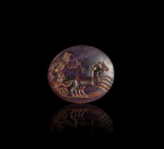 A ROMAN AMETHYST INTAGLIO DEPICTING A CHARIOT HORSE RACING SCENE , CIRCA 1ST CENTURY A.D.