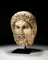 A LARGE CARVED STONE BUST OF A BEARDED MAN, CIRCA 3RD CENTURY A.D. OR LATER