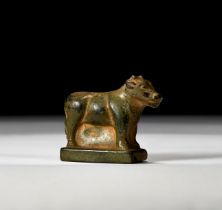 A NEAR EASTERN BRONZE FIGURE OF A BULL