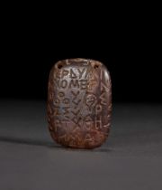 A MAGIC INSCRIBED AMULET, TO BE SOLD AT NO RESERVE