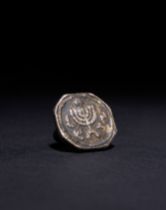 A WHITE METAL MENORAH RING WITH STAR OF DAVID, ROMAN 1ST CENTURY A.D. AND LATER