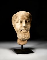 A CARVED BUST OF A ELDER MAN