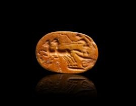 A ROMAN JASPER INTAGLIO DEPICTING A CHARIOT HORSE RACING SCENE , CIRCA 1ST CENTURY A.D.