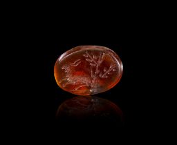 A ROMAN CARNELIAN INTAGLIO OF A WILD ANIMAL IN A FIELD, CIRCA 1ST-2ND CENTURY A.D.