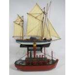 Two model ships, one a light ship the other a Sail boat. Each approx 12 inches long. See photos.