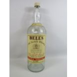 Large vintage empty Bell whiskey bottle, approx 20" tall.