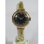 Ladies watch with Black face and white numerals, vintage era, 9ct gold Case, Swiss import marks,