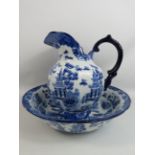 Blue and white Empire ware large jug and bowl in the willow pattern.