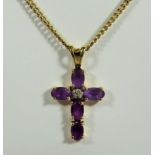 Lovely 9ct Yellow Gold Crucifix set with Amethyst hung on an 18 inch Yellow gold Chain. Total weight