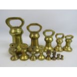 13 Victorian brass bell weights.
