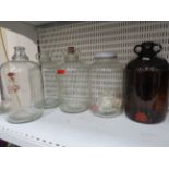Three Clear Glass plus one smoked glass Demijohns
