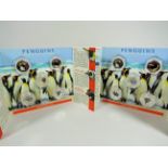 Two Pobjoy mint sealed display wallets, each containing Five, Enamel set 50p coins depicting