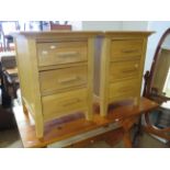 Two attractive blonde wood bedside cabinets