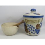 A large West german Rumtofts jar and a large Pestle and Mortar.