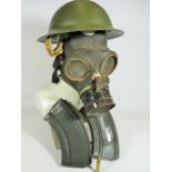 Bodie Helmet, Gas mask, Two Bren Gun magazines plus a dummy round.
