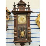 Early 20th Century Oak Cased chiming wall clock with brass face. Runs well. Approx 38 x 16 inches.