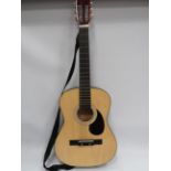 Three quarter size accoustic guitar in soft carry case.