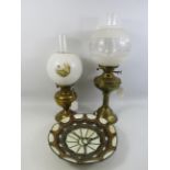 2 Vintage brass oil lamps and a Tiffany style light shade.