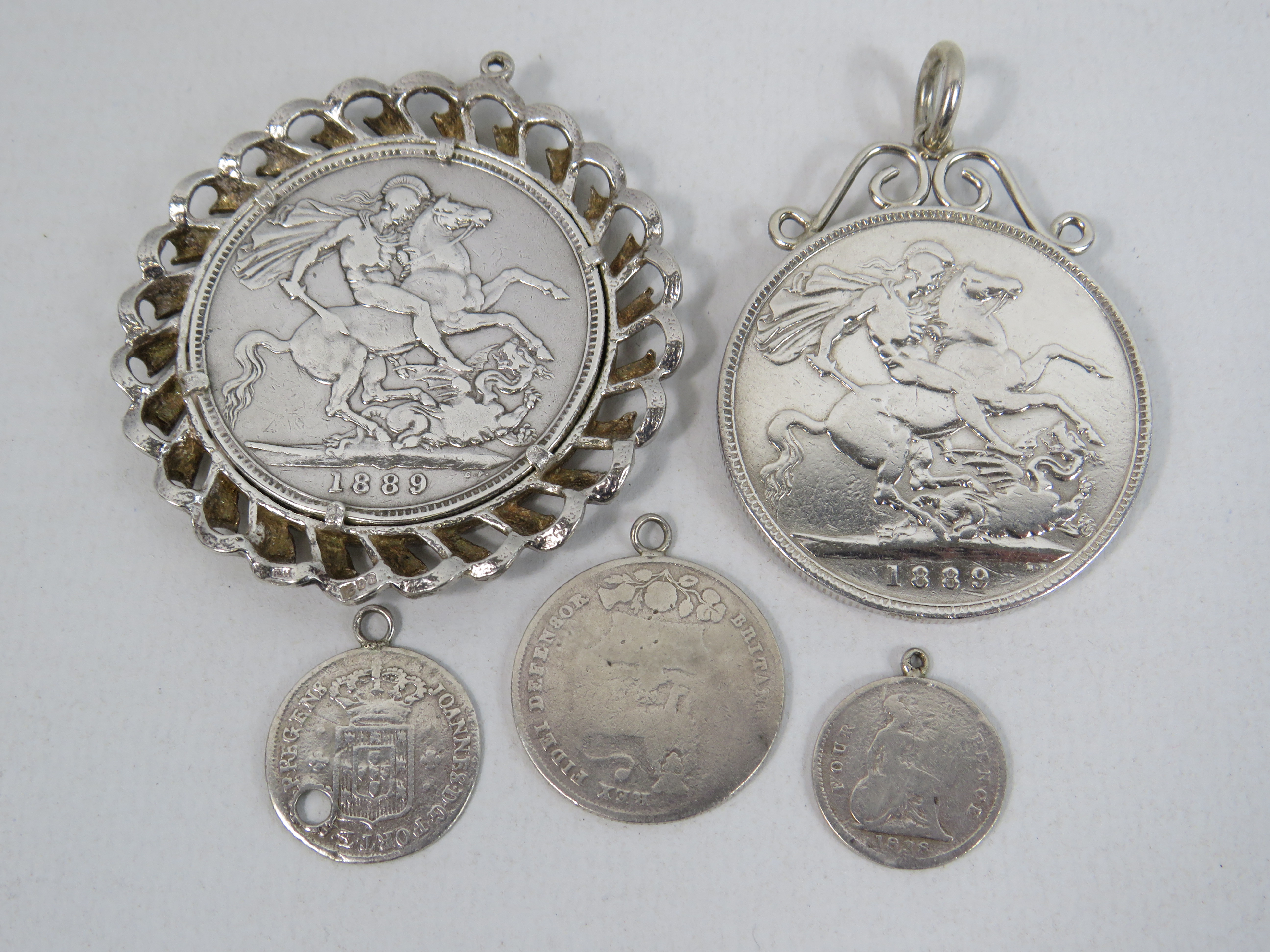 2 Mounted 1899 Queen Victoria silver Crowns plus 3 small silver coin pendants. Total weight 80.4