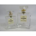 2 Channel No 5 empty perfume bottles.