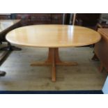 Nicely made Blonde oak Oval table. Raised on a central pillar