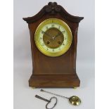French wooden mantel clock with enamel face and standing on brass bun feet, Fully working, Approx