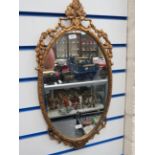 Pretty gilt framed oval mirror which measures 22 x 10 inches