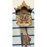 Black Forest style painted cuckoo clock in running order. See photos.