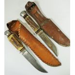 Two 1950's vintage, German made Antler handled Scouting knives, Both with Leather belt scabbards.