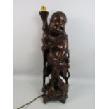 Vintage oriental carved root wooden figural lamp which stands, 22.5 inches tall.