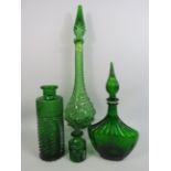 2 Empoli green glass decanters/ Genie bottles and 2 other bottles.