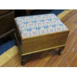 Pretty oak sewing box/stool with needlepoint top. Raised on cabriole legs it measures H:15 x W:17 x