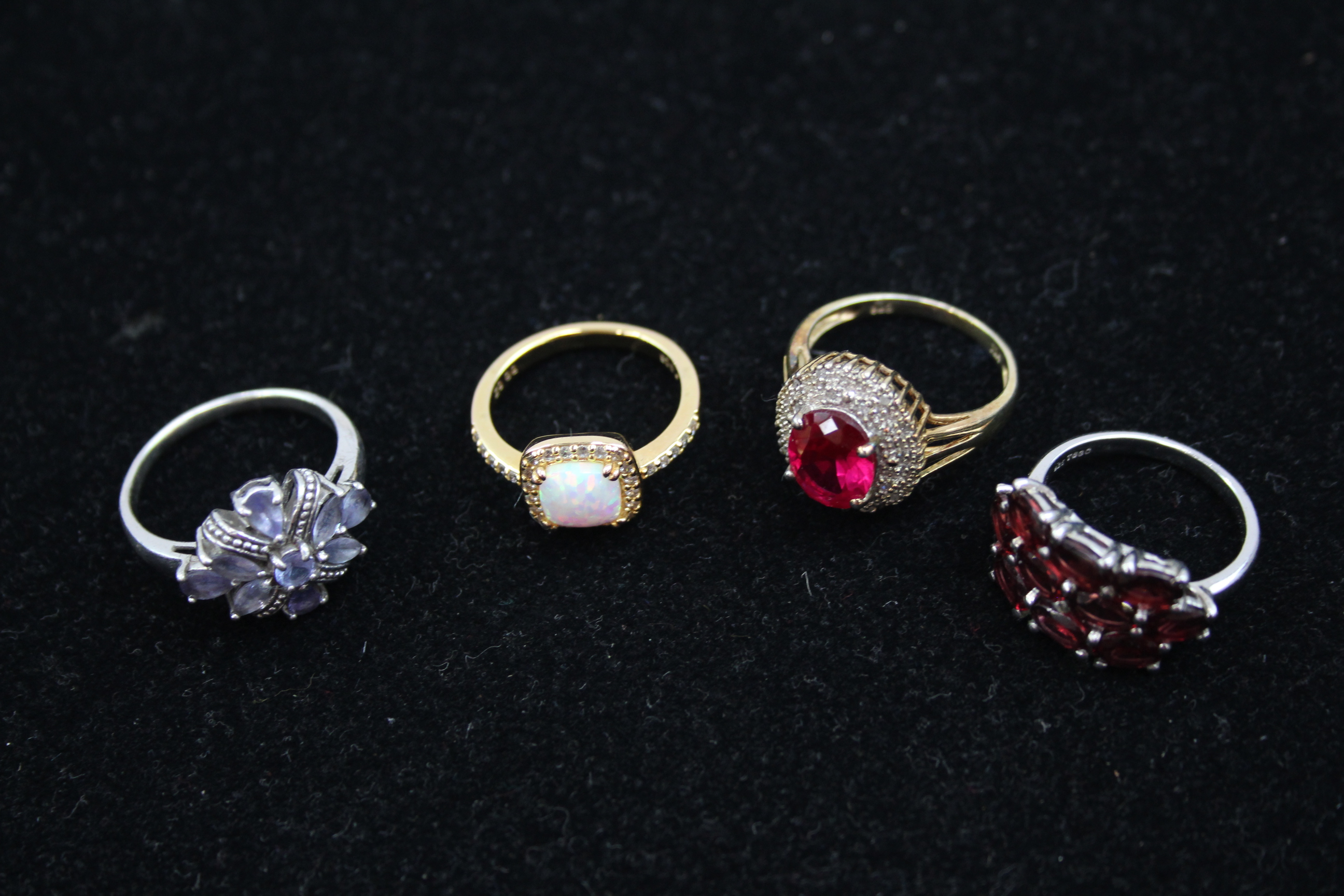 4 X .925 Gemstone Set Rings Including Opal And Synthetic Ruby