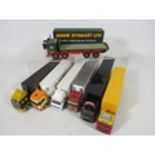 Eight various Model Trucks on plinths