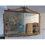 Decorative gilt effect plastic framed mirror with bevelled glass panels Swags & Tails decoration.