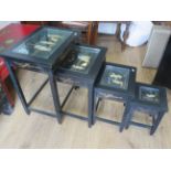 Set of Four oriental inspired stacking tables, each decorated with figures from horn and painted in