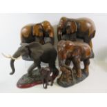 3 Large carved wooden elephant figures plus one other, the tallest measures approx 13" high and