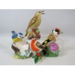 Royal Worcester Thrush figurine and 3 John Beswick bird figurines.