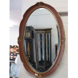 Bevelled glass oval mirror. Lovely frame which measures 24 x 16 Inches. See photos. S2