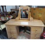 Knee hole bedroom dressing table with mirror above. Made in bleached weather effect pine with carved