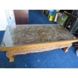 Beautifully carved Opium style table believed to have been brought from Thailand. Raised on carved