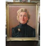 Nicely painted oil on canvas portrait of a lady in a Victorian style dress. Housed in a gilt frame.