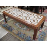 Retro Teak Coffee table with Ten ceramic tiled top.. H:16 x W:44 x D:20 Inches. Excellent condition.