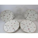 Four antique dinner plates with hand applied flowers. Together with a frosted glass floral dish. One