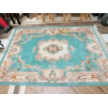 Oriental style fringed woolen rug which measures 104 x 66 inches in good clean condition. See photos