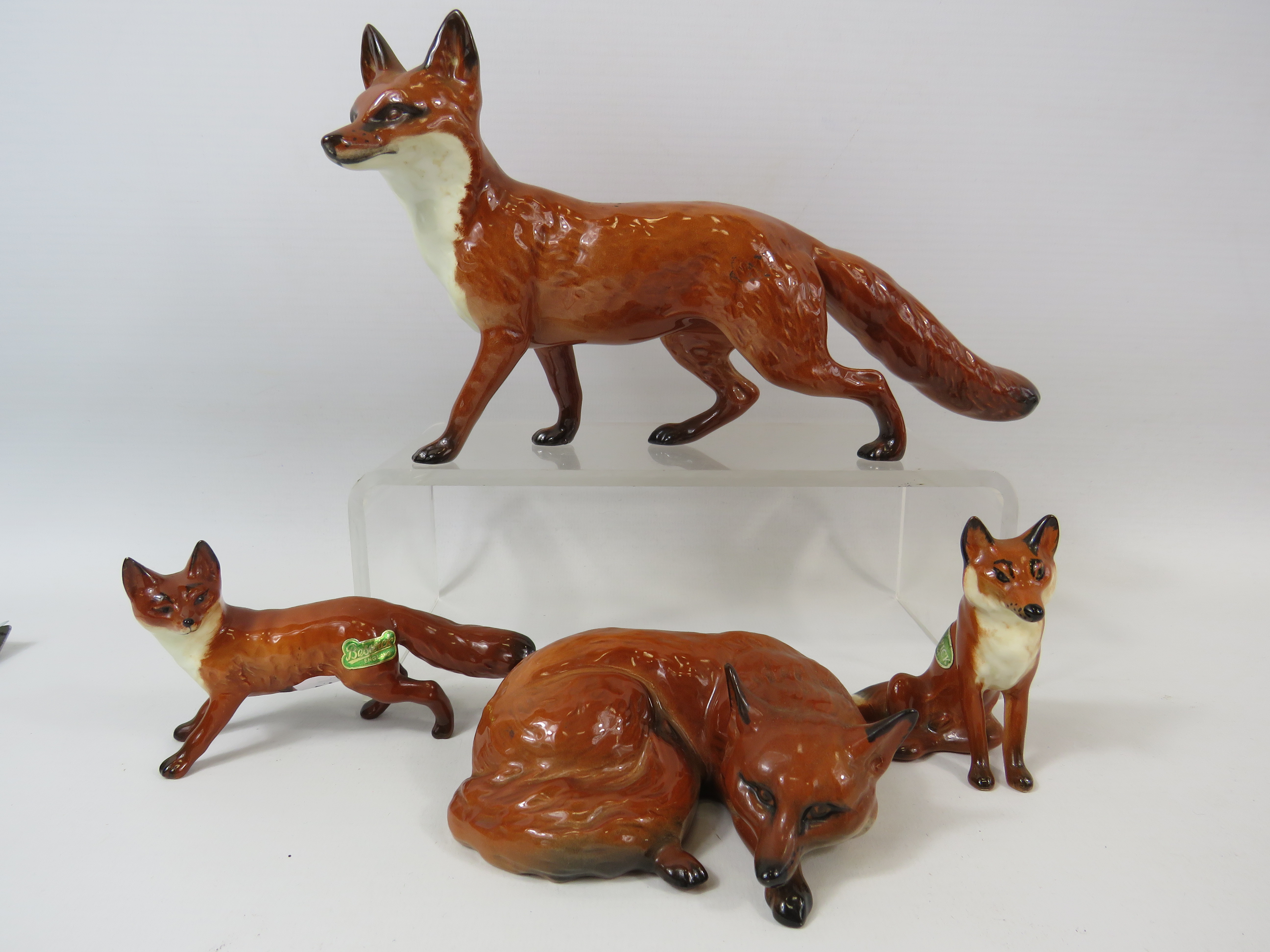 4 Beswick Fox Figurines.