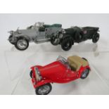 Three Franklin mint precision models of an MG Roadster, Bentley, Rolls Royce. No boxes. Ex Display