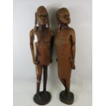 Matched pair of beautifully carved African Tribal figures. Carved from very heavy and dense hardwoo