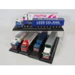 Six various model trucks on plinths