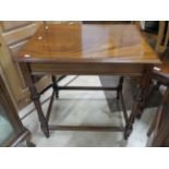 Lovely Mahogany occasional table with turned legs and stretchers. Great colour and grain. H:29 x W: